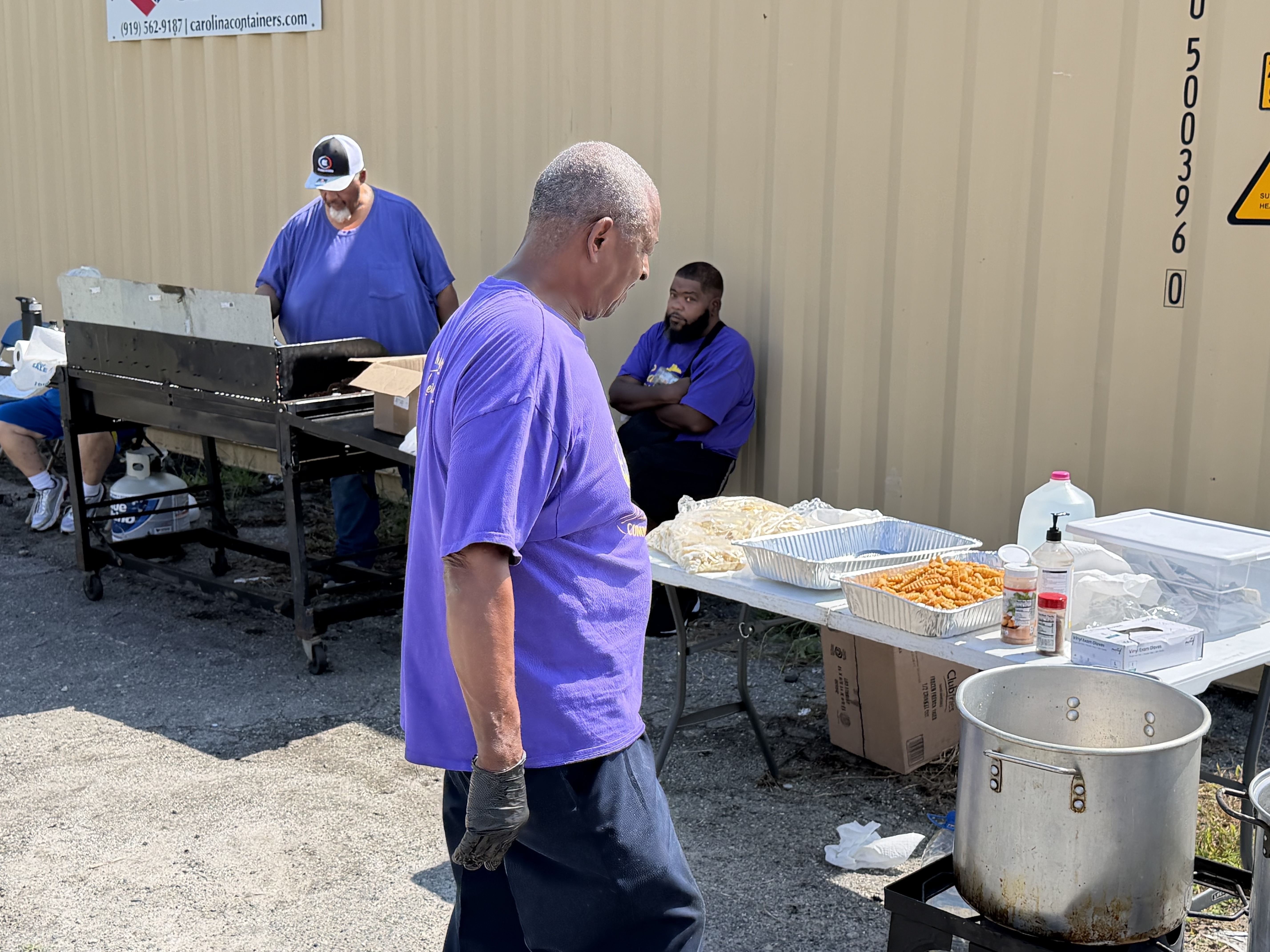 Gateway to Heaven volunteers preparing food for neighbors on a third Saturday