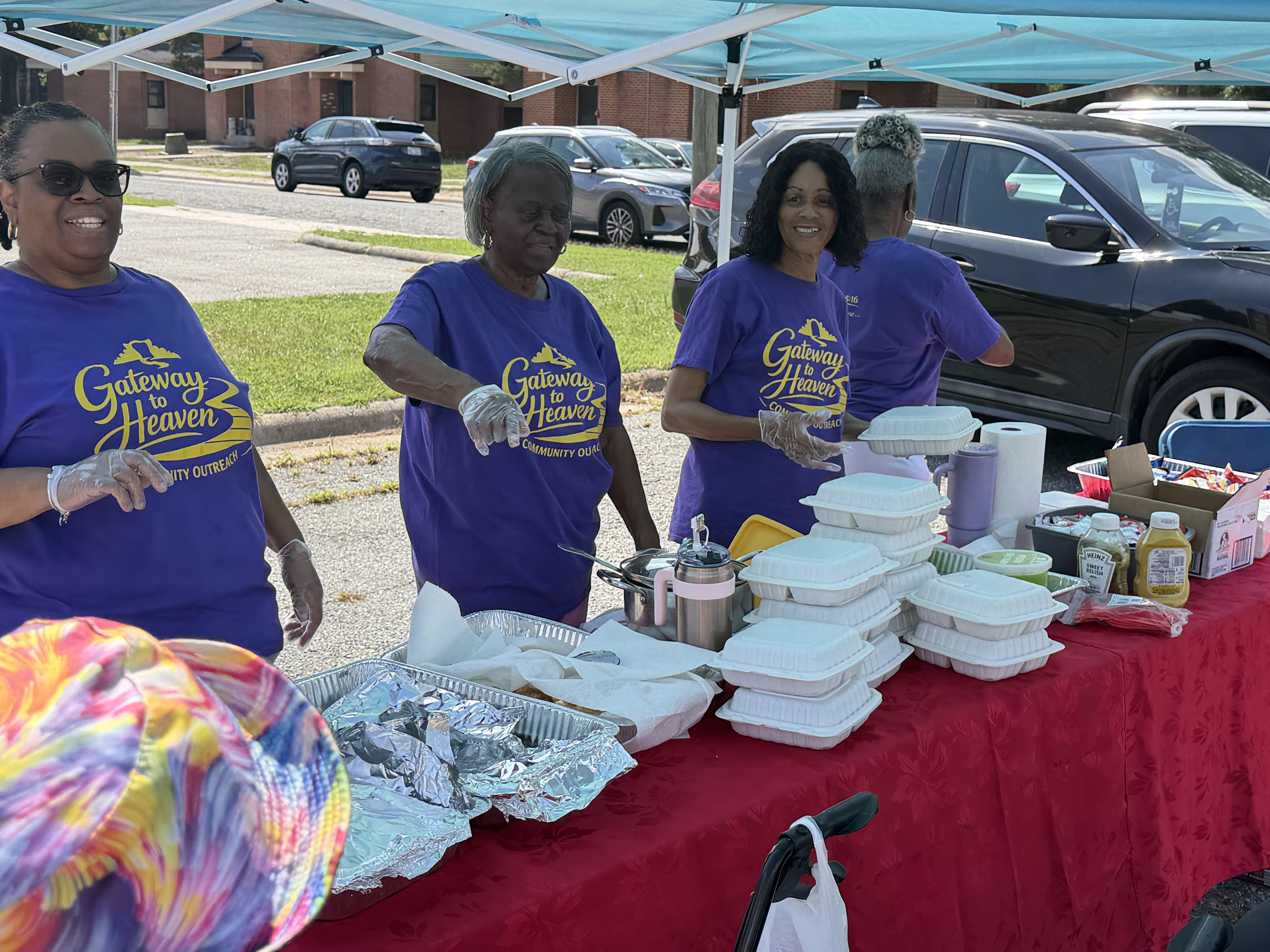 Gateway to Heaven volunteers serving meals together