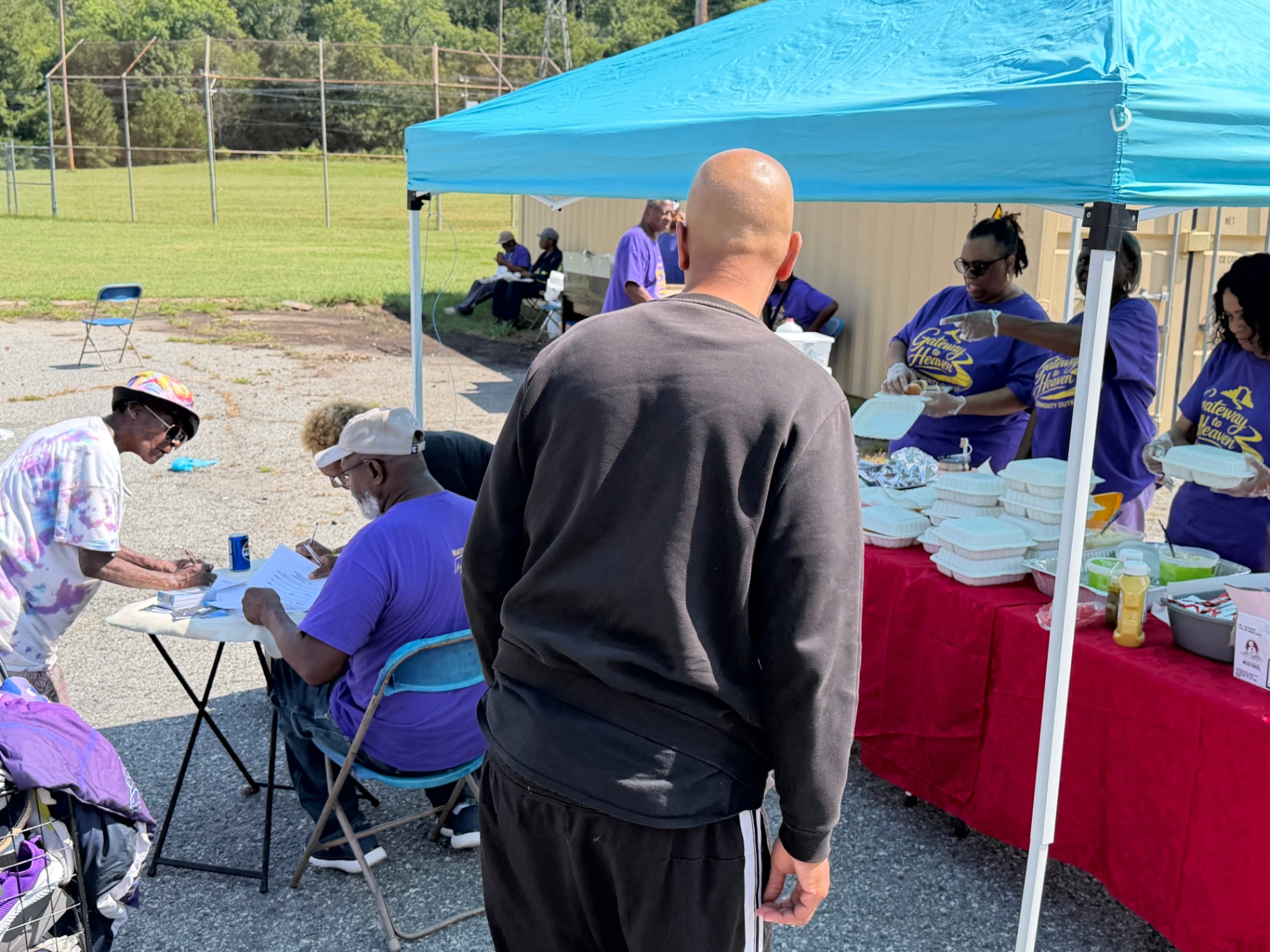 A neighbor checking in with Gateway to Heaven volunteers